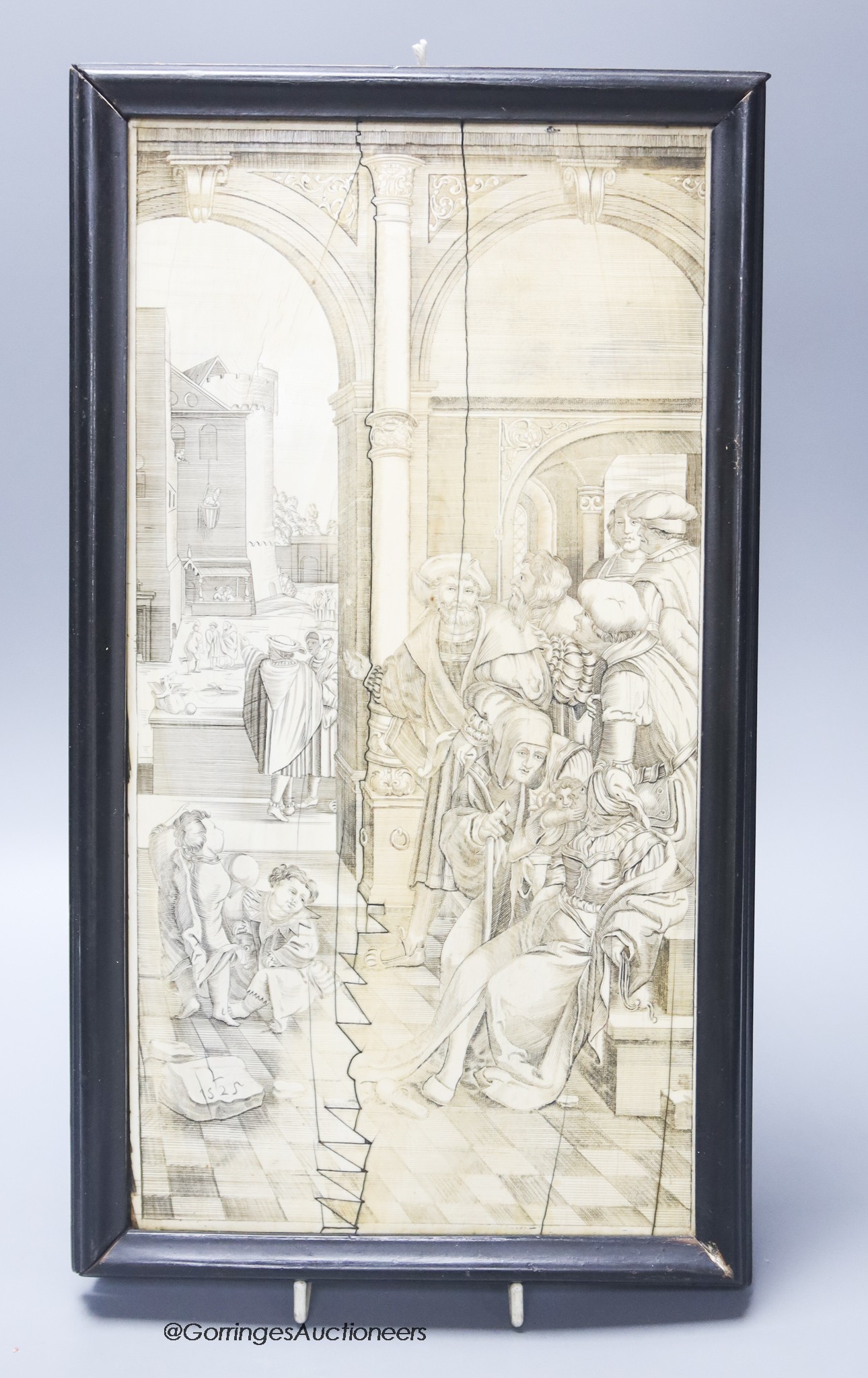 A 19th century engraved and sepia-stained ivory plaque with interior scene, width 18cm height 36cm